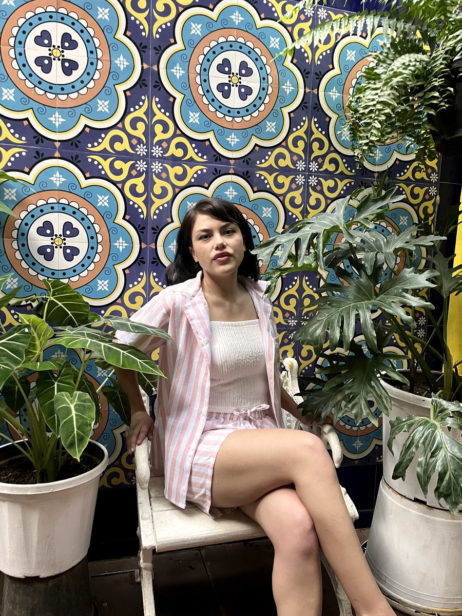 Customer in a pink stripe piece